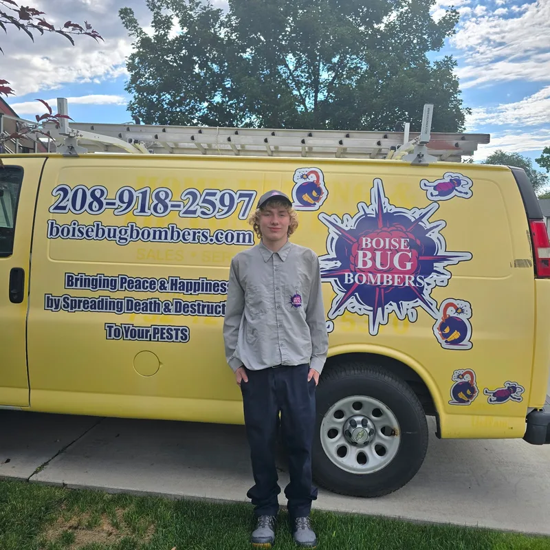 Boise Bug Bombers technician Bradley Finley beside the Boise Bug Bombers van in Boise, Idaho.