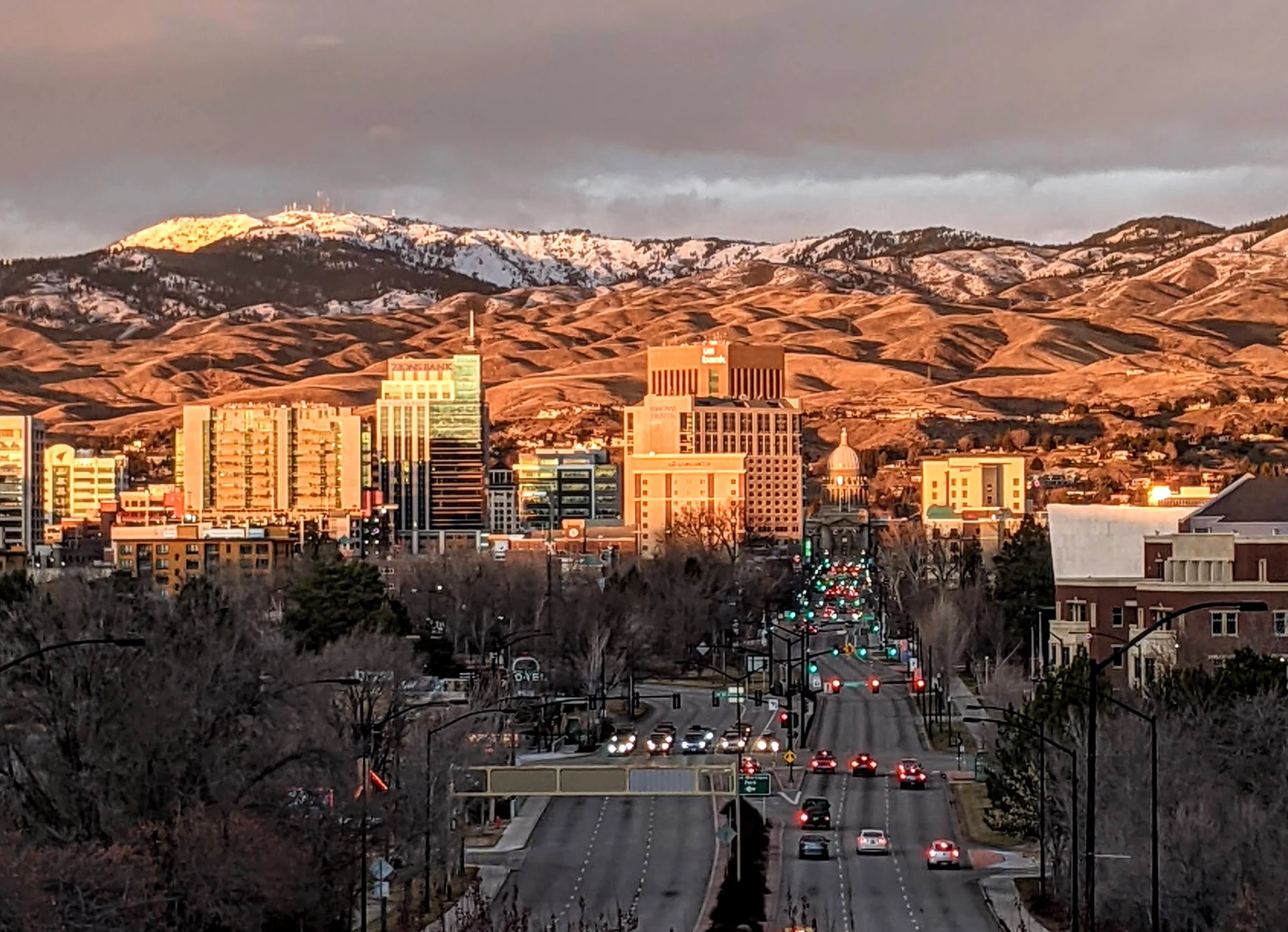 Photograph of downtown Boise with the Idaho State Capitol building backed by the snow-dusted Boise Foothills, the area Boise Bug Bombers serves